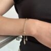 Pulsera con Símbolos variados laminada en Oro 18k